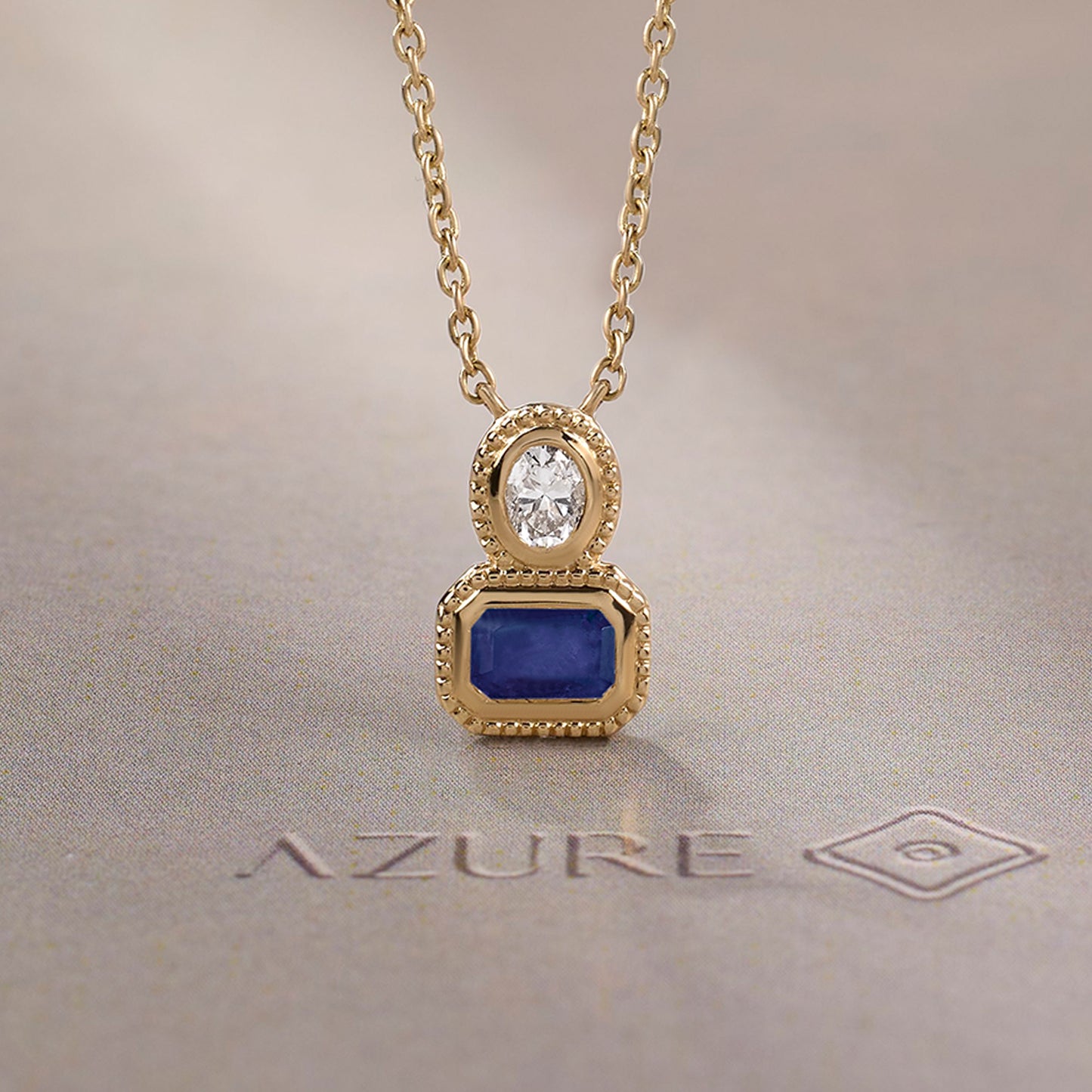 Oval Diamond & Emerald-Cut Blue Sapphire Milgrain Pendant