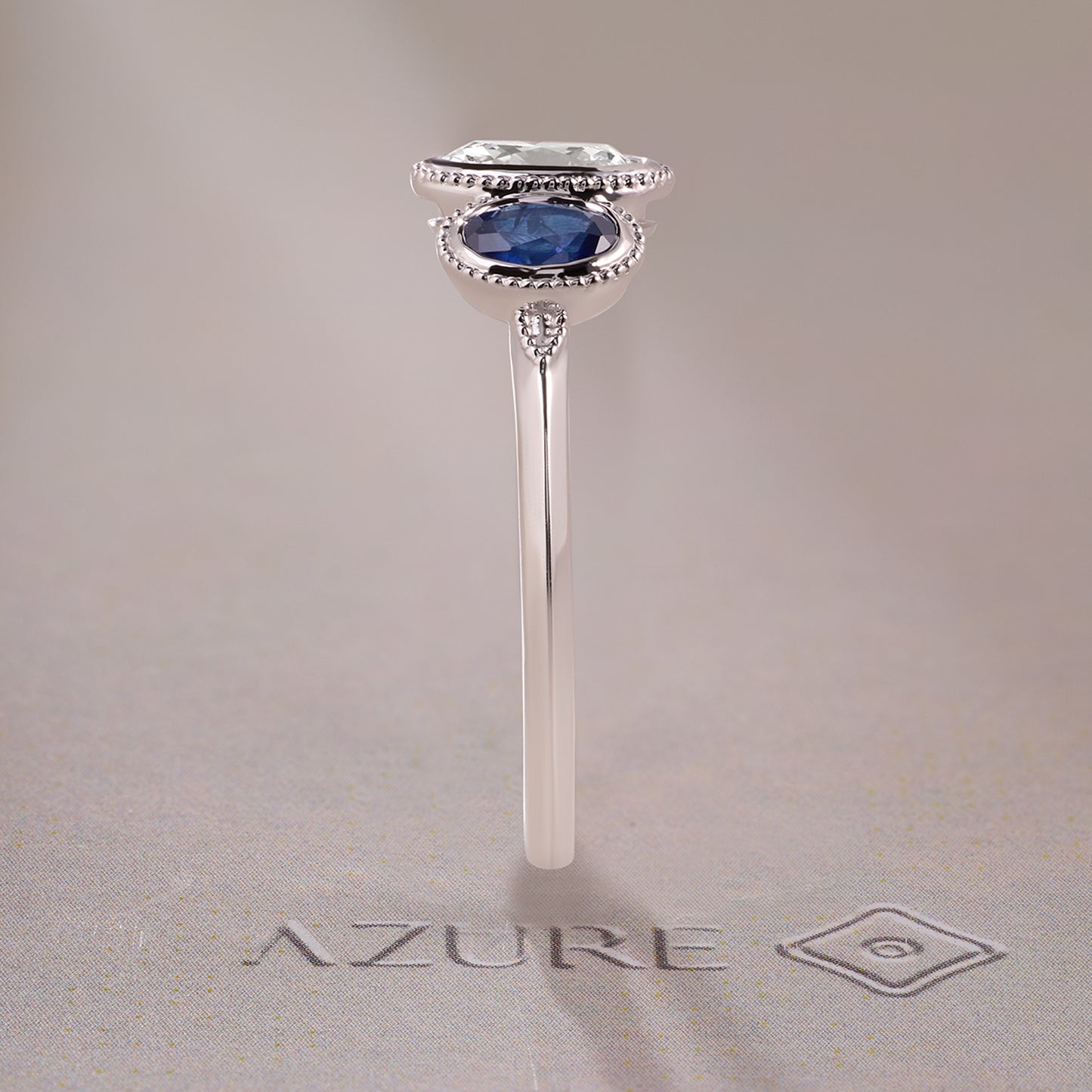 Oval Diamonds & Blue Sapphire Ring