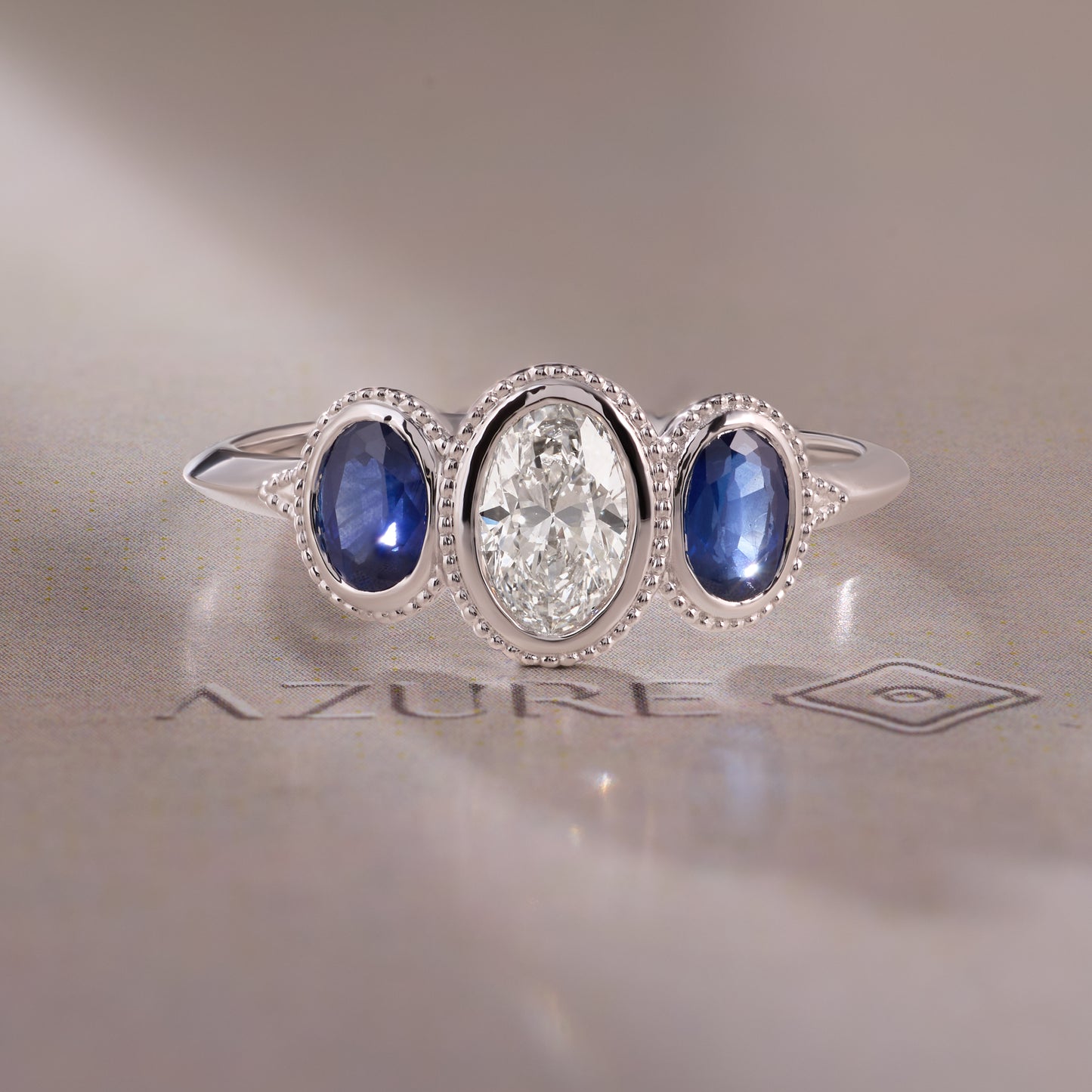 Oval Diamonds & Blue Sapphire Ring