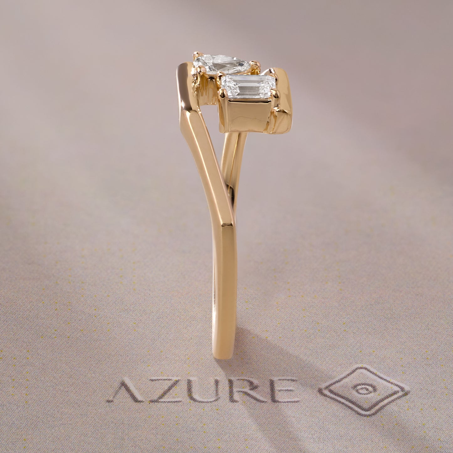 Emerald-Cut and Pear Diamond Ring