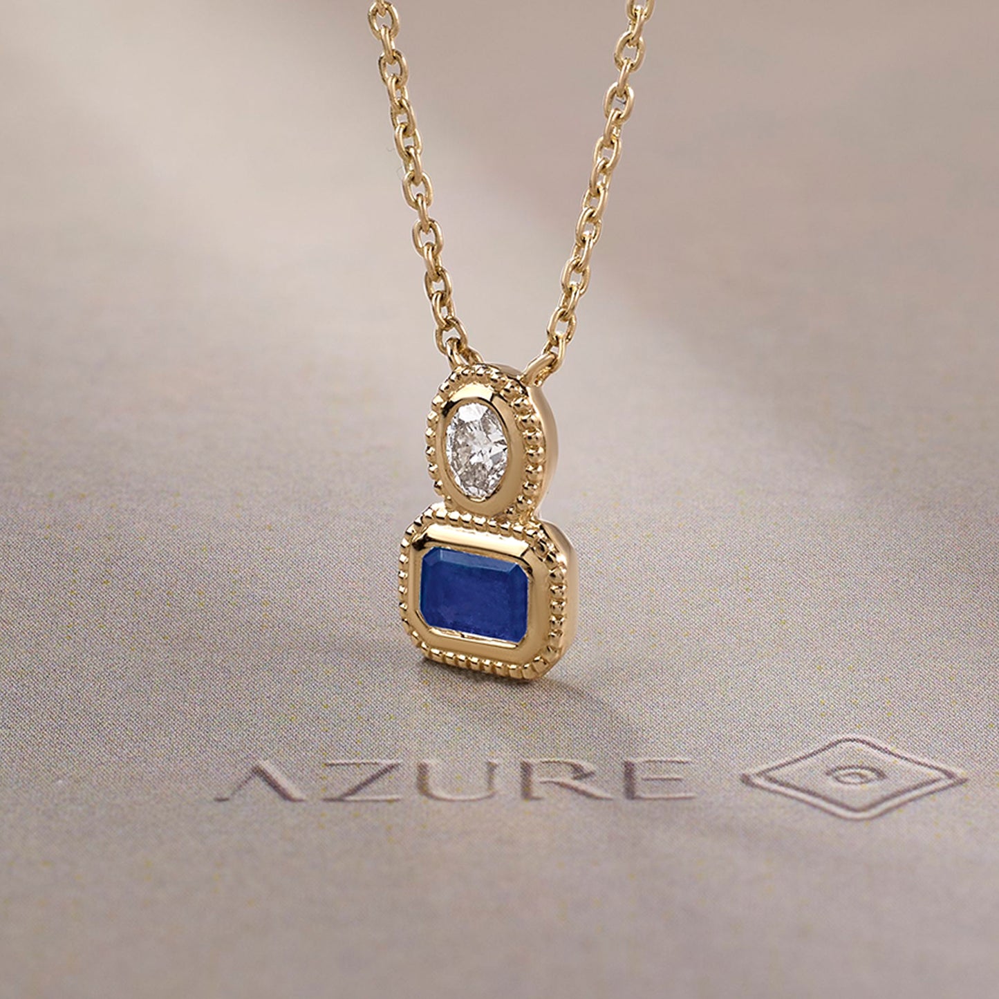 Oval Diamond & Emerald-Cut Blue Sapphire Milgrain Pendant