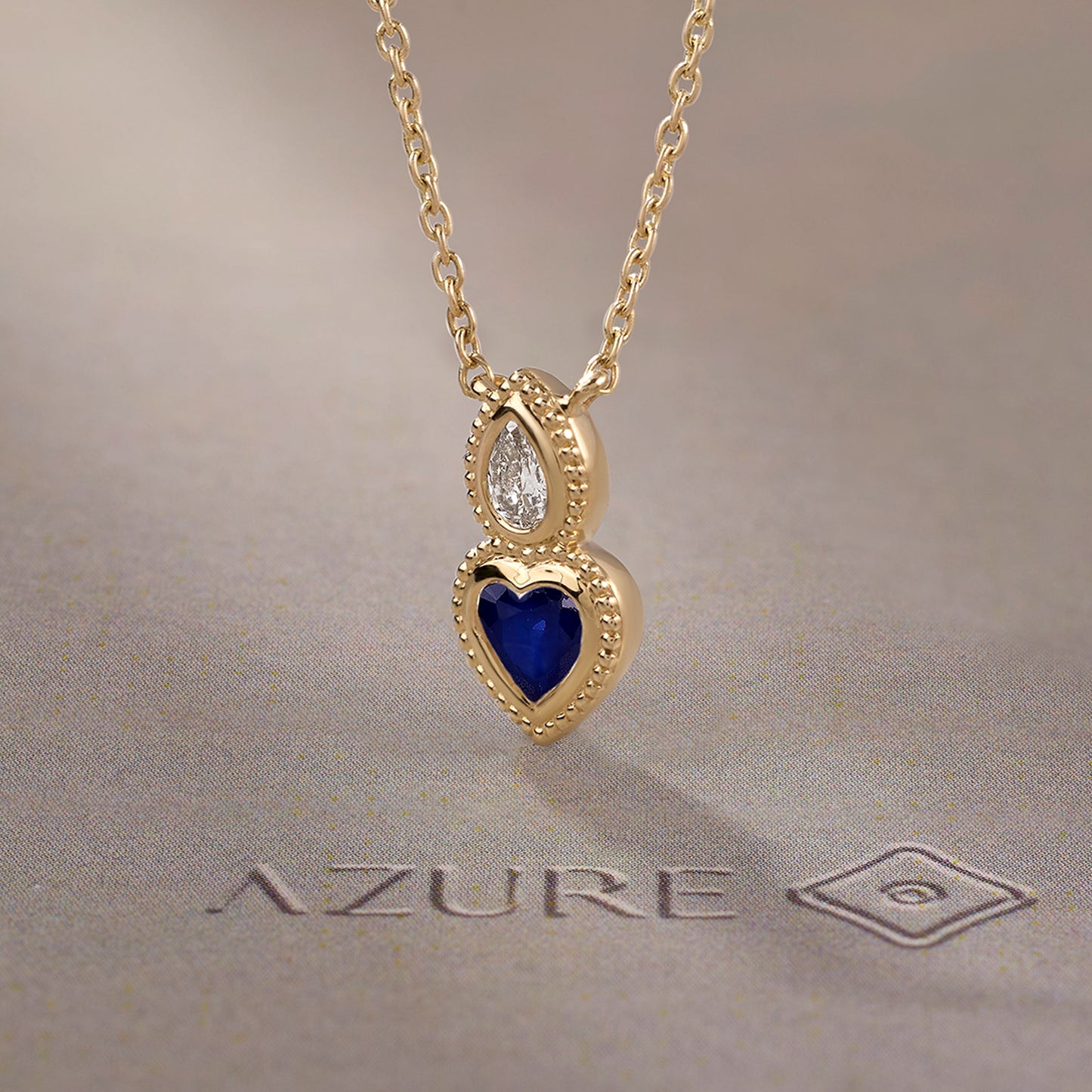 Pear Diamond & Blue Sapphire Heart Pendant