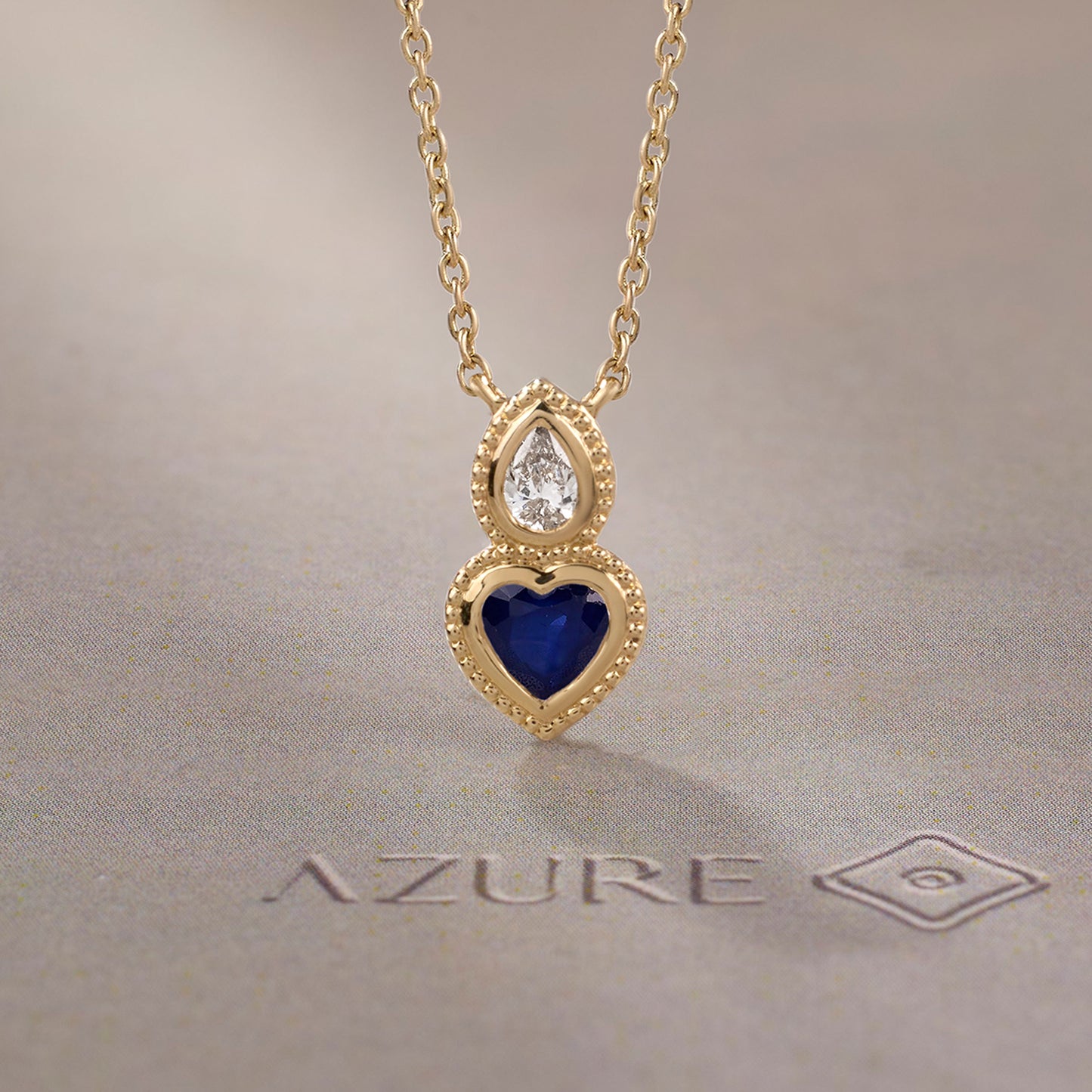 Pear Diamond & Blue Sapphire Heart Pendant