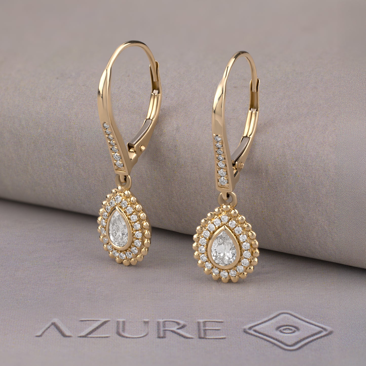 Pear And Round Diamond Earrings