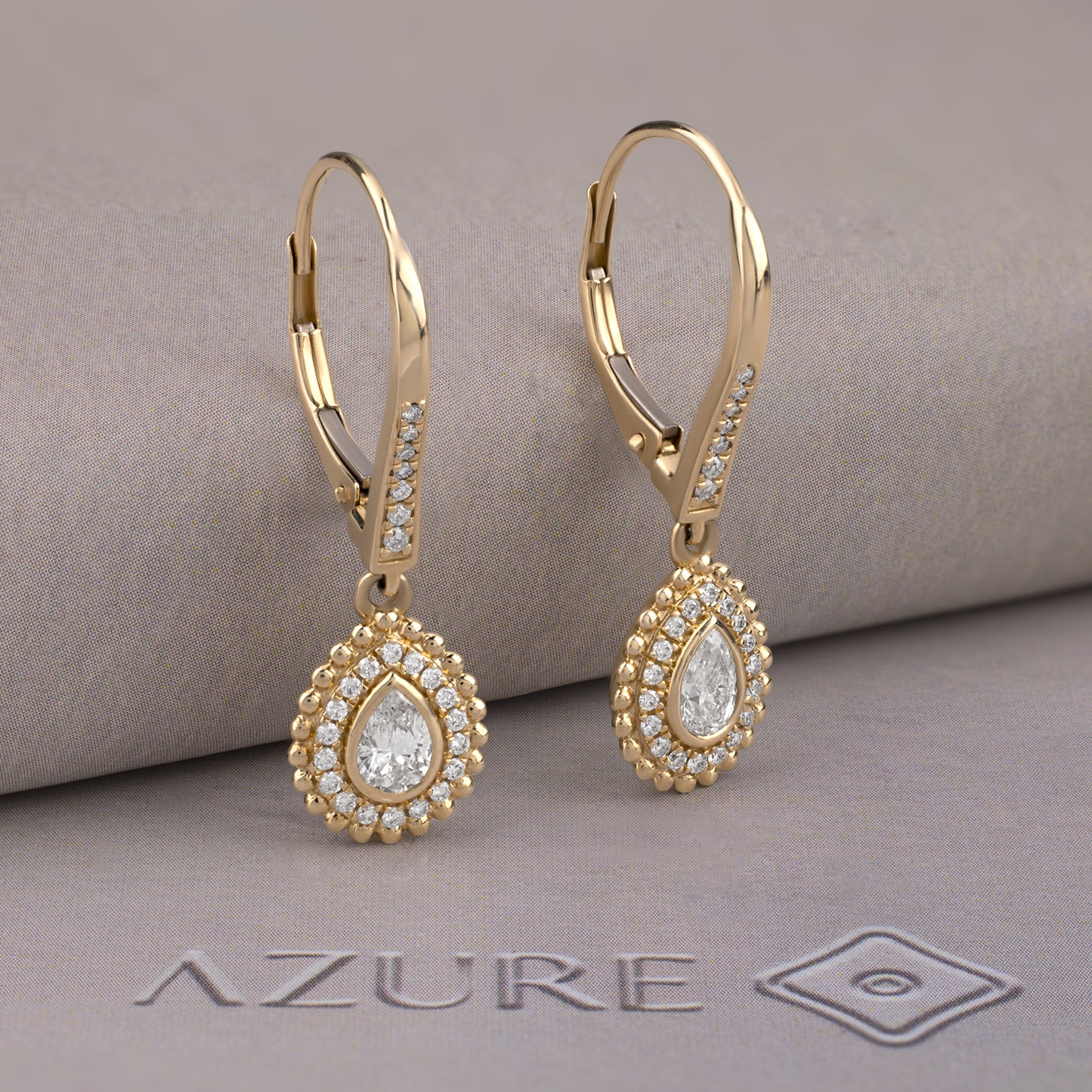 Pear And Round Diamond Earrings